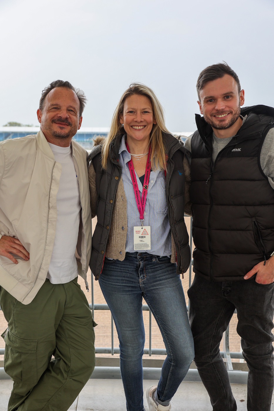 Guests at the Purple Sectors Karting Grand Prix beside a circuit.
